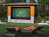 TV mounted on outside wall of man cave